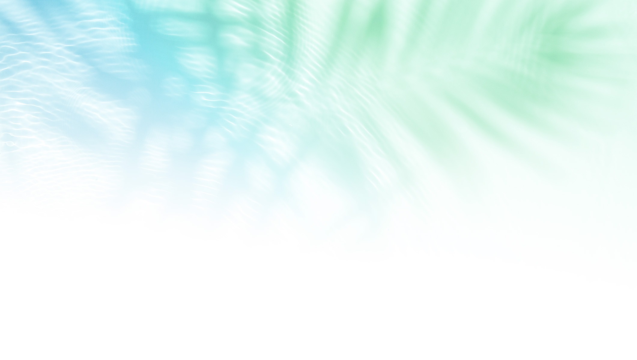 Blurred image with soft blue and green gradient, suggesting an abstract nature scene. No recognizable landmarks or buildings present.